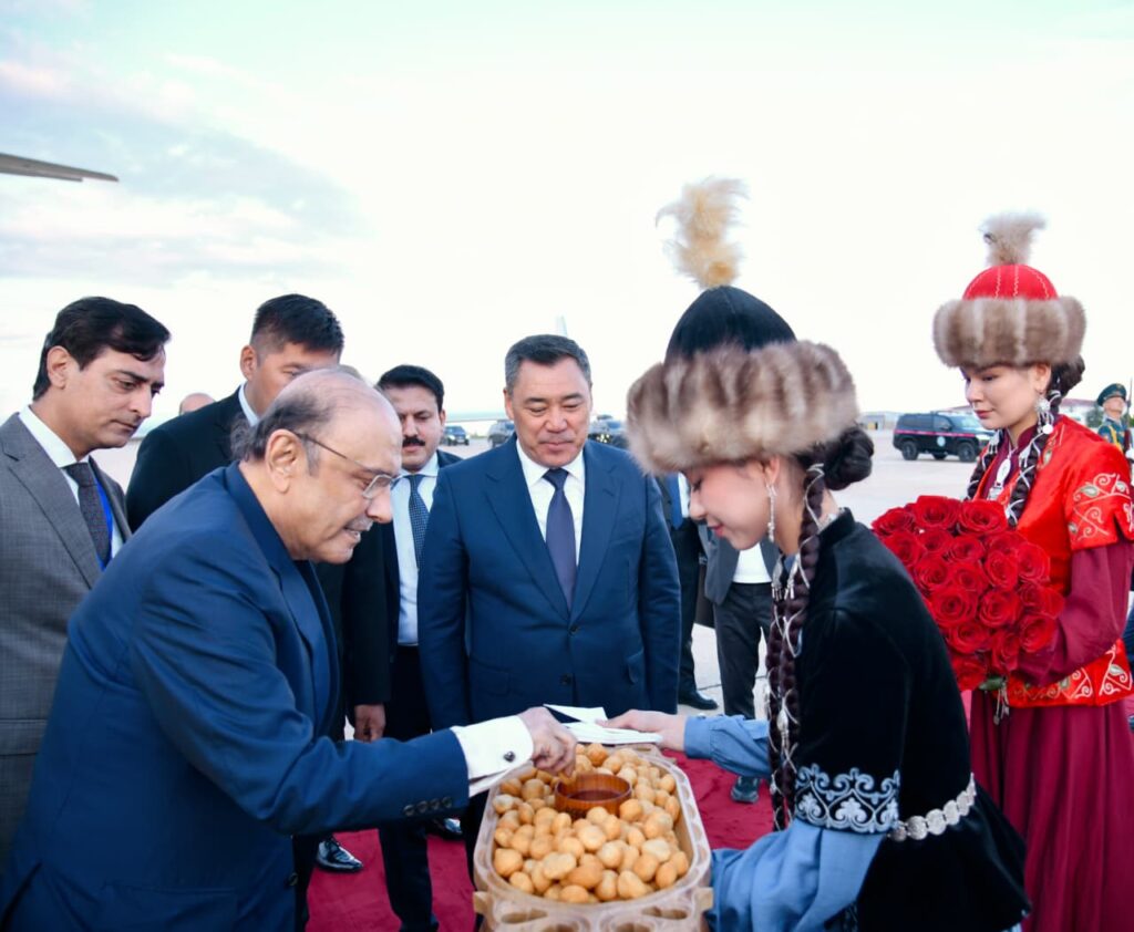 President of Pakistan Asif Ali Zardari is presented with traditional Kyrgyz boorsok